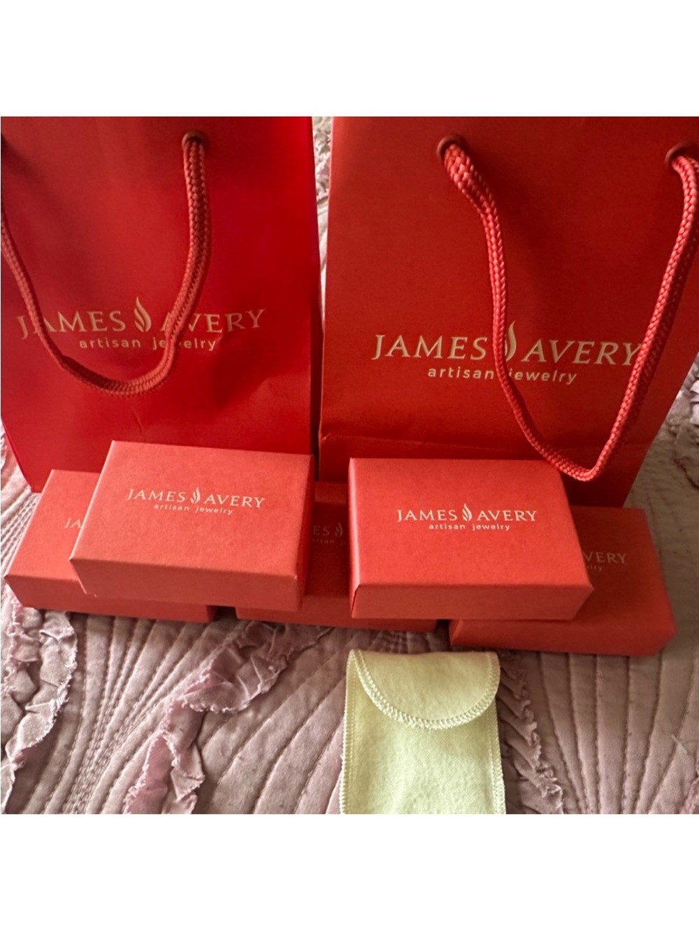 James Avery red jewelry gift bags and boxes with gold logo